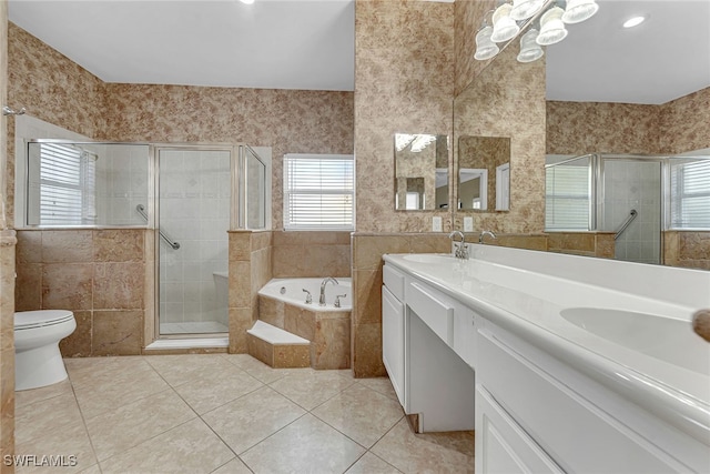 full bathroom featuring vanity, toilet, tile patterned floors, and plus walk in shower