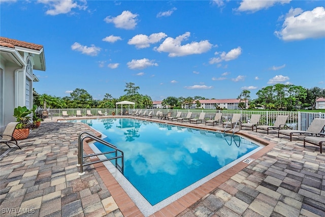 view of swimming pool with a patio area