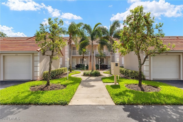 view of front of home featuring a balcony and a garage