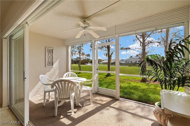 sunroom / solarium with ceiling fan