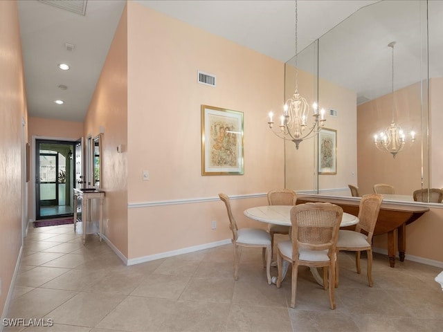 dining room featuring light tile patterned floors and an inviting chandelier