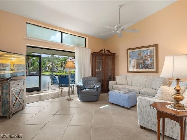 living room with ceiling fan, light tile patterned flooring, and high vaulted ceiling