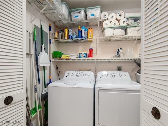 washroom with washing machine and clothes dryer