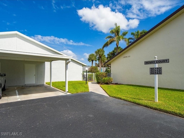 exterior space with a carport