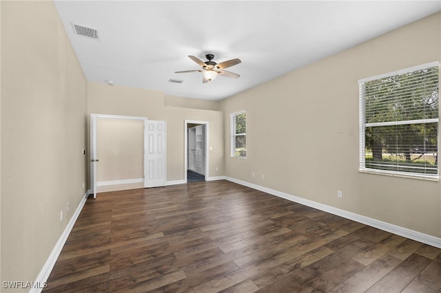 3645 70th Ave NE, Naples, FL 34120 - unfurnished bedroom featuring dark wood-style flooring and ceiling fan