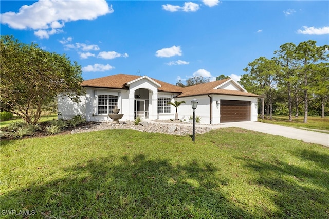 ranch-style home with a front lawn and a garage