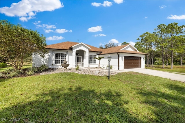 3645 70th Ave NE, Naples, FL 34120 - ranch-style house featuring driveway, a front lawn, a garage, and stucco siding