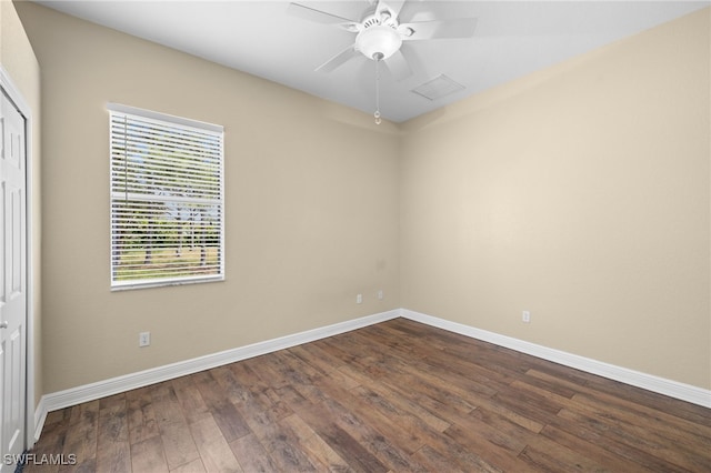 unfurnished room featuring ceiling fan and dark hardwood / wood-style flooring