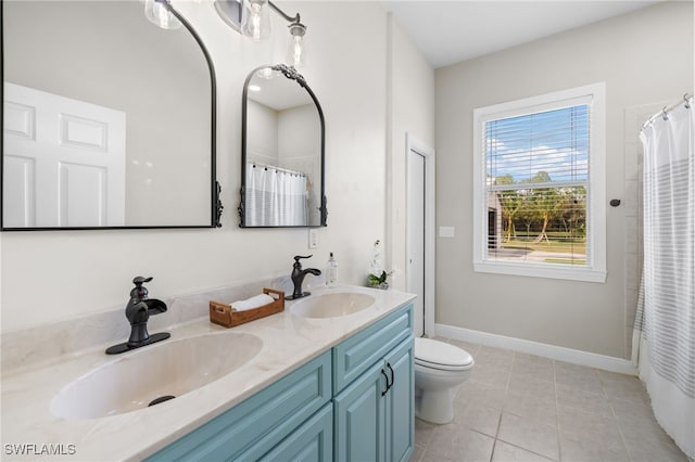 bathroom featuring vanity, tile patterned floors, toilet, and a shower with curtain