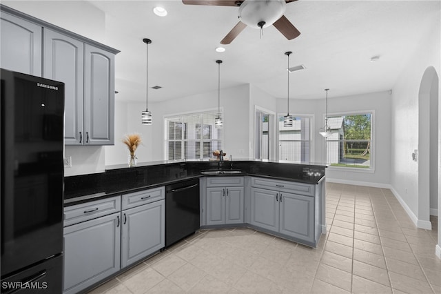 kitchen with black appliances, gray cabinetry, decorative light fixtures, and sink