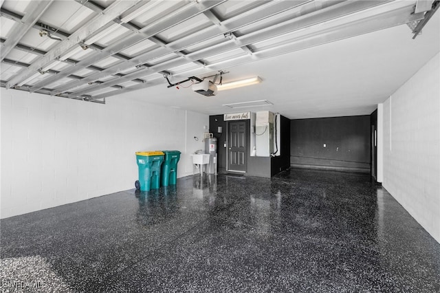 garage featuring a garage door opener and sink