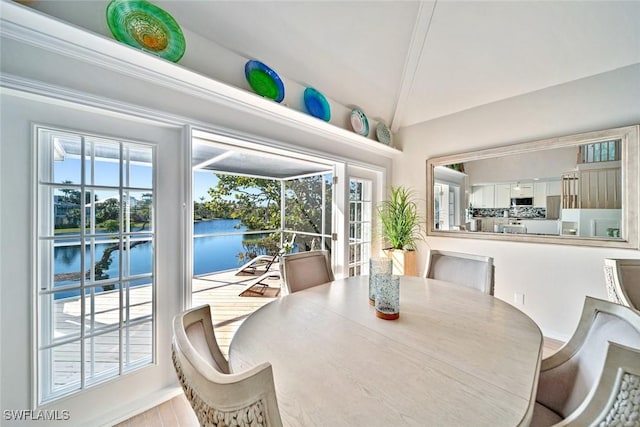 dining room featuring a water view