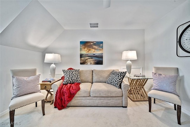 living room featuring lofted ceiling and carpet floors