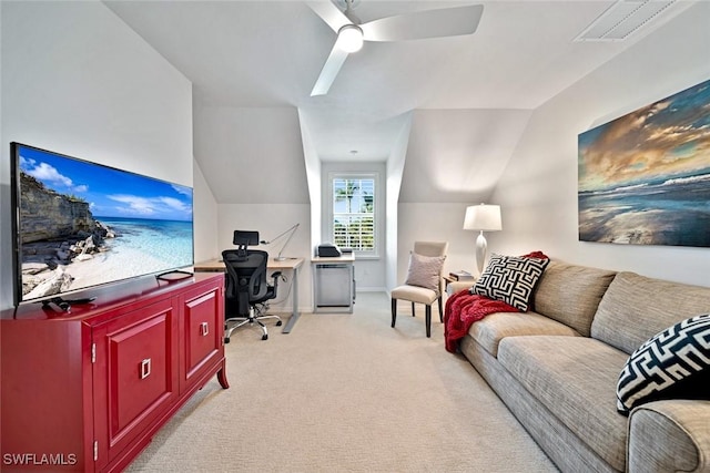 living room featuring lofted ceiling, light colored carpet, and ceiling fan