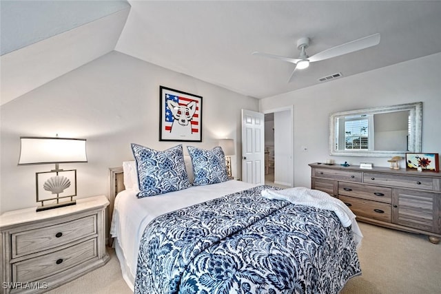 bedroom with vaulted ceiling, light colored carpet, and ceiling fan