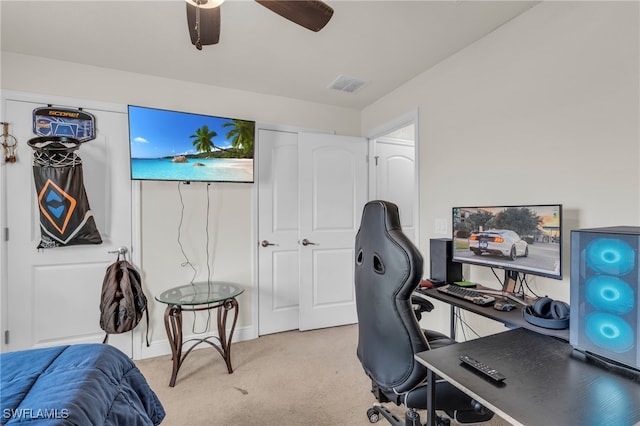 carpeted office with ceiling fan