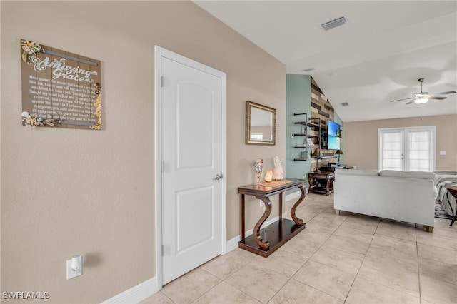 living room featuring french doors, ceiling fan, light tile patterned floors, and vaulted ceiling