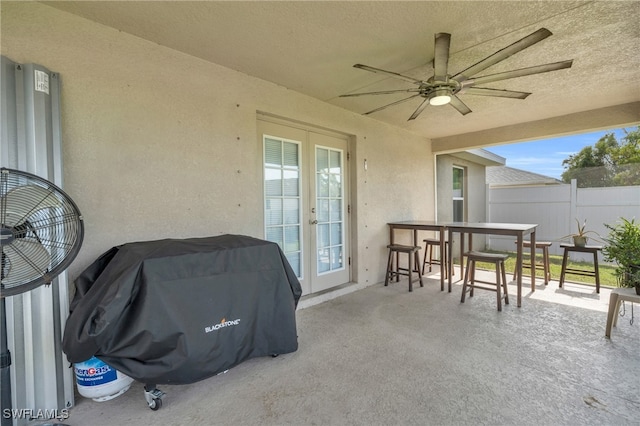 view of patio / terrace with ceiling fan and grilling area