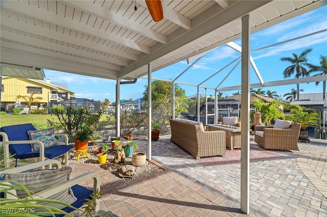 view of patio with outdoor lounge area and a lanai