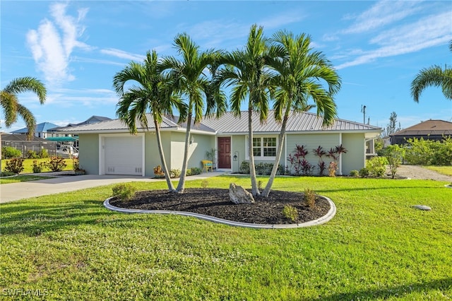 ranch-style home with a front lawn and a garage