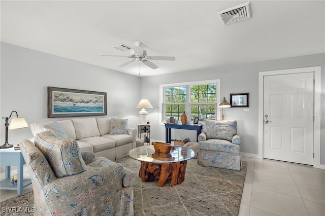 living room with light tile patterned floors and ceiling fan