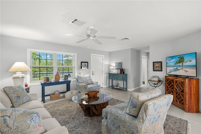 tiled living room with ceiling fan