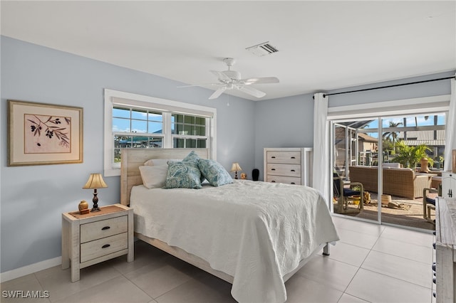 bedroom with light tile patterned floors, access to outside, and ceiling fan