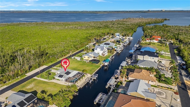 birds eye view of property featuring a water view