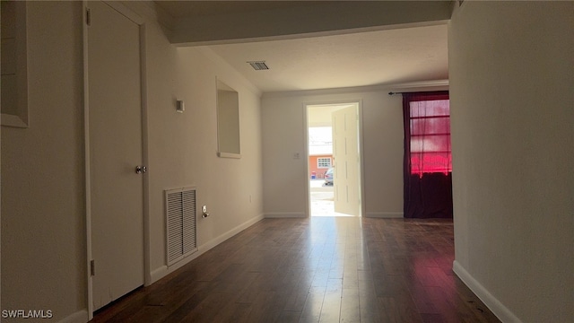 corridor featuring dark hardwood / wood-style floors