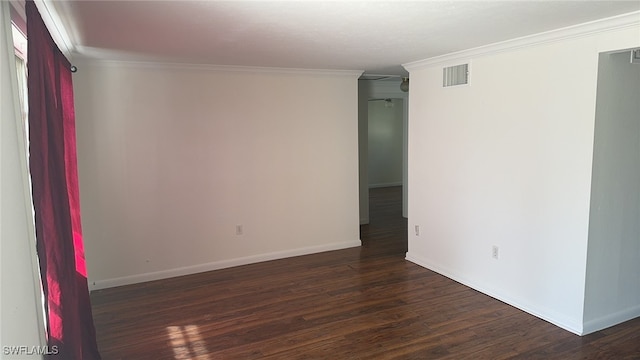 empty room with dark wood-type flooring and ornamental molding