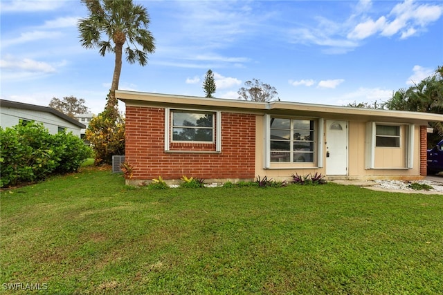 bungalow-style house featuring a front yard