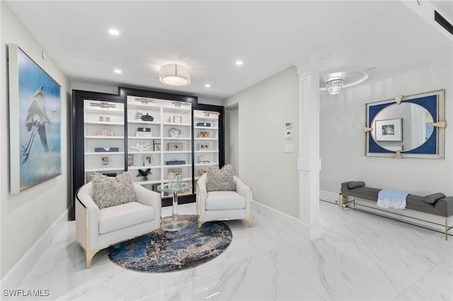 3971 Gulf Shore Blvd N Unit 1505, Naples, FL 34103 - living area with decorative columns, marble tiled flooring, baseboards, and recessed lighting