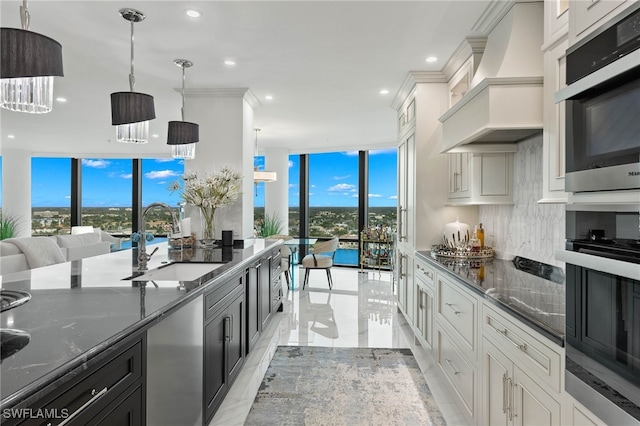 3971 Gulf Shore Blvd N Unit 1505, Naples, FL 34103 - kitchen with a sink, custom range hood, expansive windows, dark stone countertops, and recessed lighting