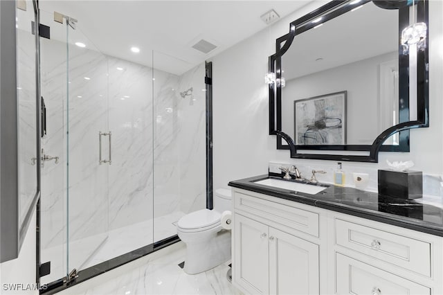 bathroom with vanity, toilet, and walk in shower