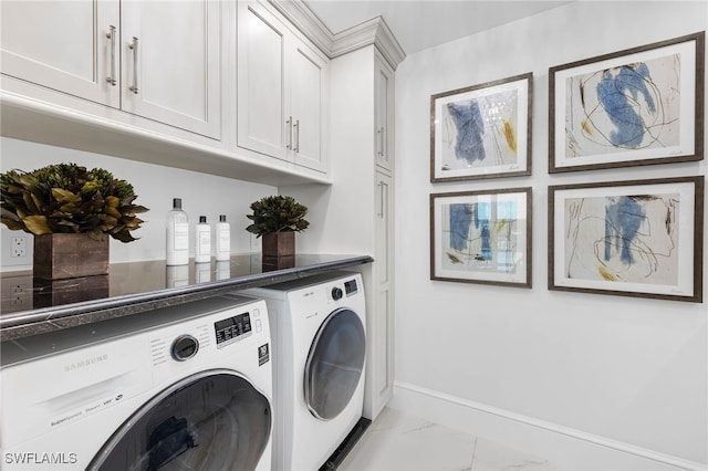 3971 Gulf Shore Blvd N Unit 1505, Naples, FL 34103 - clothes washing area with independent washer and dryer, marble look tile flooring, cabinet space, and baseboards