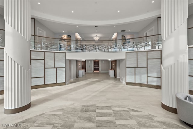 3971 Gulf Shore Blvd N Unit 1505, Naples, FL 34103 - building lobby featuring recessed lighting, stairs, and a high ceiling