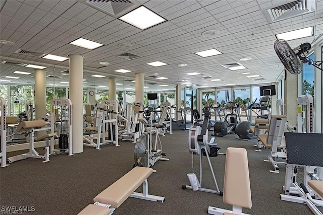 workout area with expansive windows and a healthy amount of sunlight