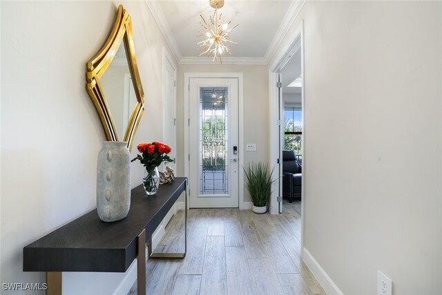 doorway to outside with wood-type flooring, an inviting chandelier, and ornamental molding