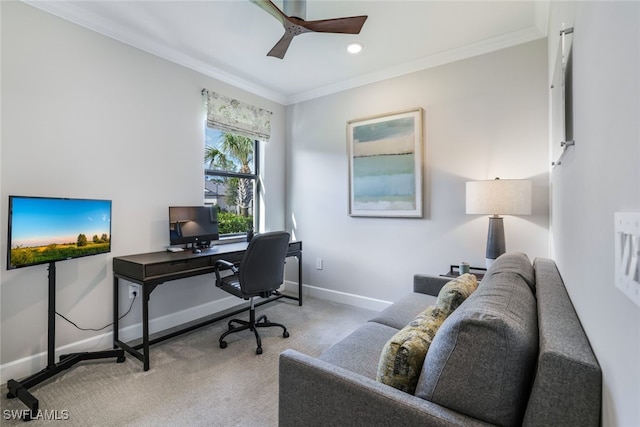 office space featuring crown molding, light carpet, and ceiling fan