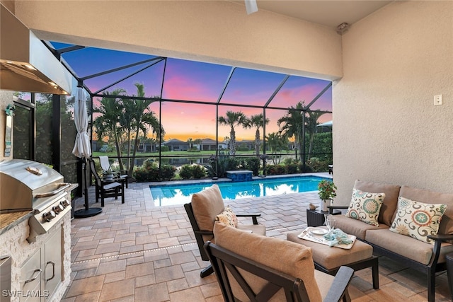 pool at dusk featuring outdoor lounge area, area for grilling, a lanai, and a grill