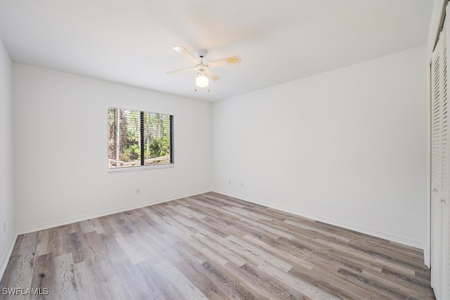 unfurnished room featuring light wood-type flooring and ceiling fan