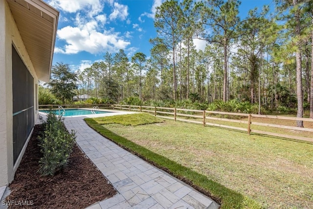 view of yard featuring a fenced in pool