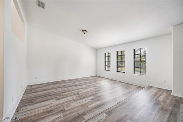 unfurnished room featuring wood-type flooring