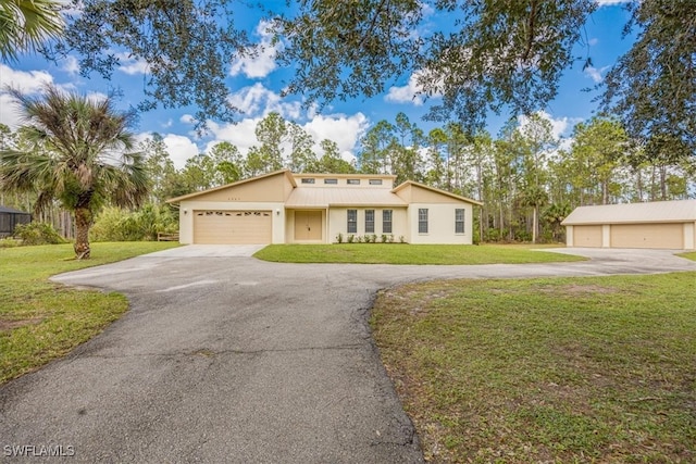 view of front of house featuring a front yard and a garage