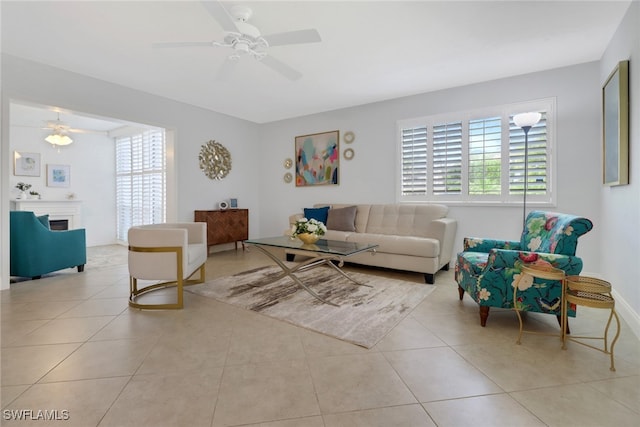 tiled living room with ceiling fan