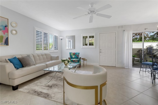 living room featuring ceiling fan and light tile patterned floors