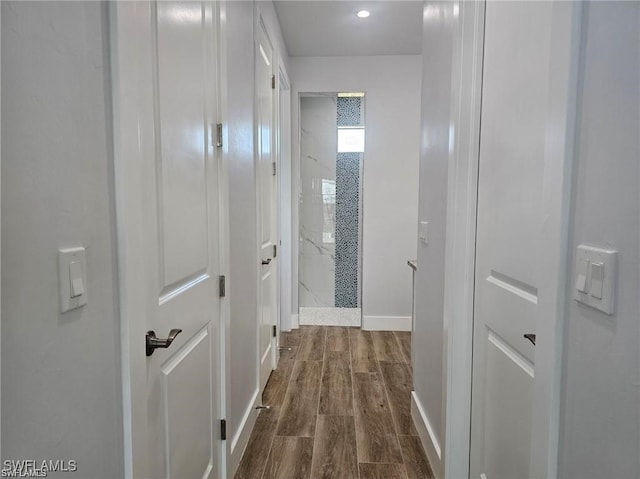 corridor featuring dark hardwood / wood-style floors