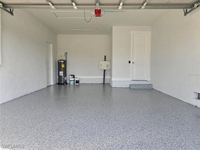 garage featuring a garage door opener and electric water heater