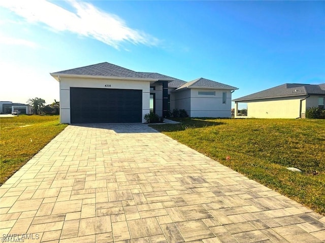 view of front of house featuring a front yard and a garage