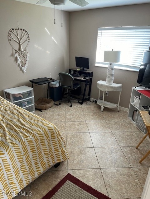 tiled bedroom with ceiling fan